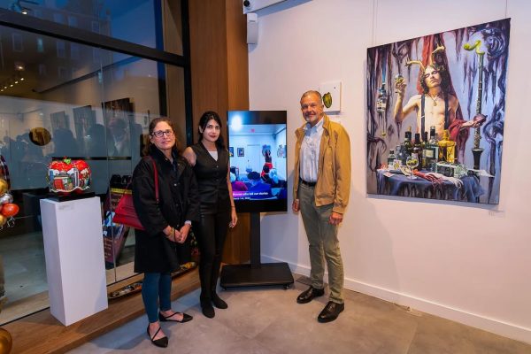 a group of people standing in front of a tv