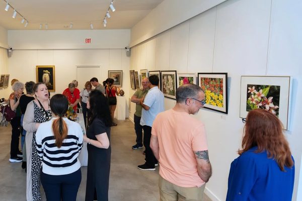 a group of people looking at art