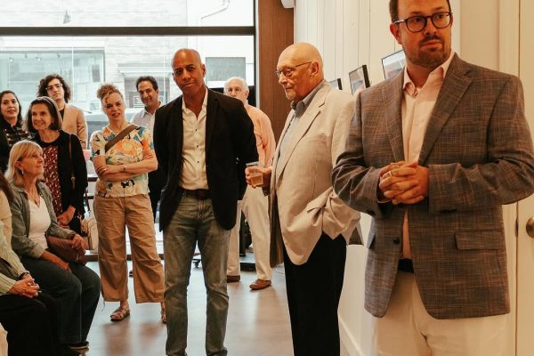 a group of people standing in a hallway